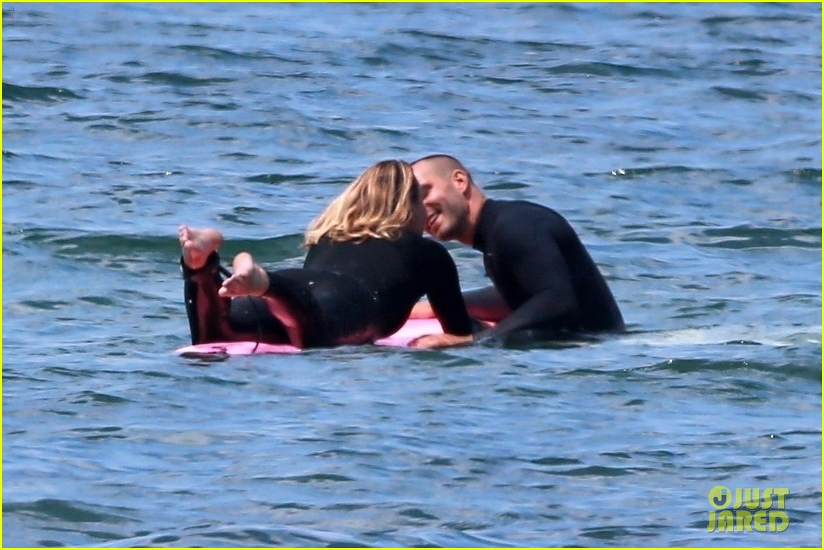 robin wright clement giraudet kisses while surfing 084463005
