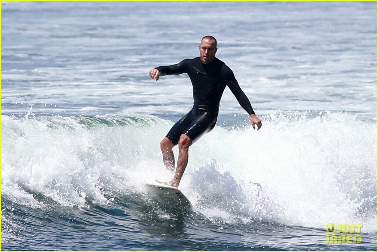 robin wright clement giraudet kisses while surfing 174463014