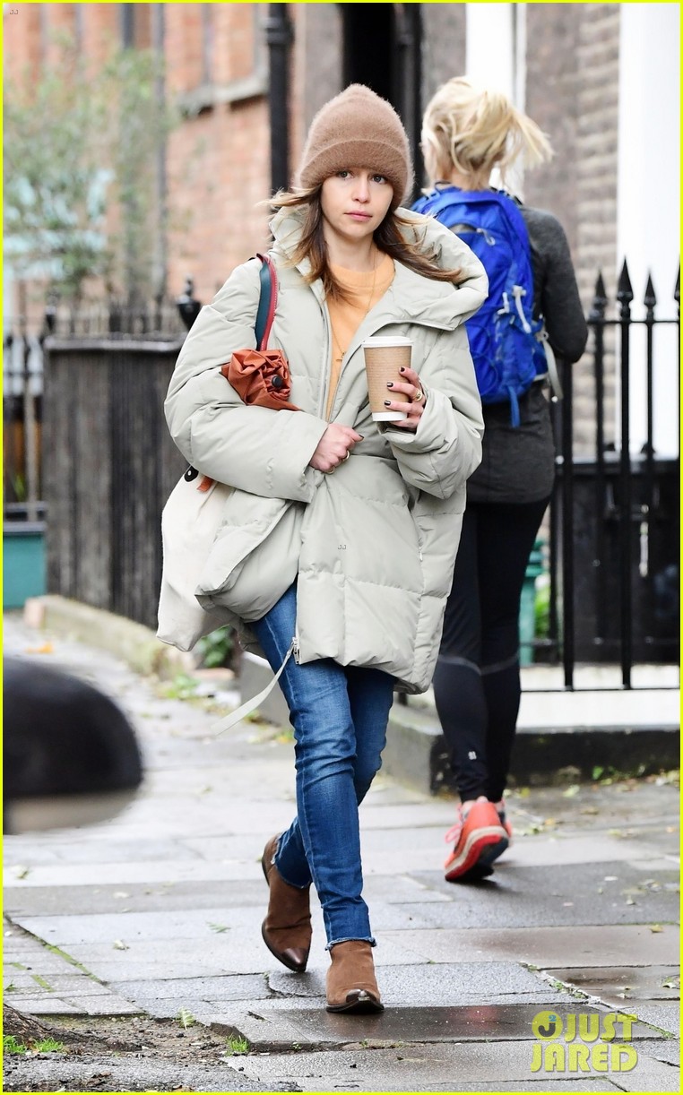 emilia clarke bundles up during a chilly fall day 104495628
