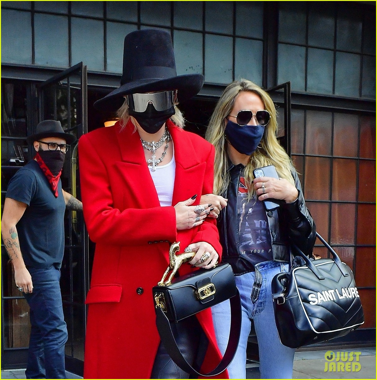 miley cyrus tophat red coat leaving hotel mom nyc 01