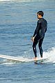 kyle howard in a wetsuit surfing 01