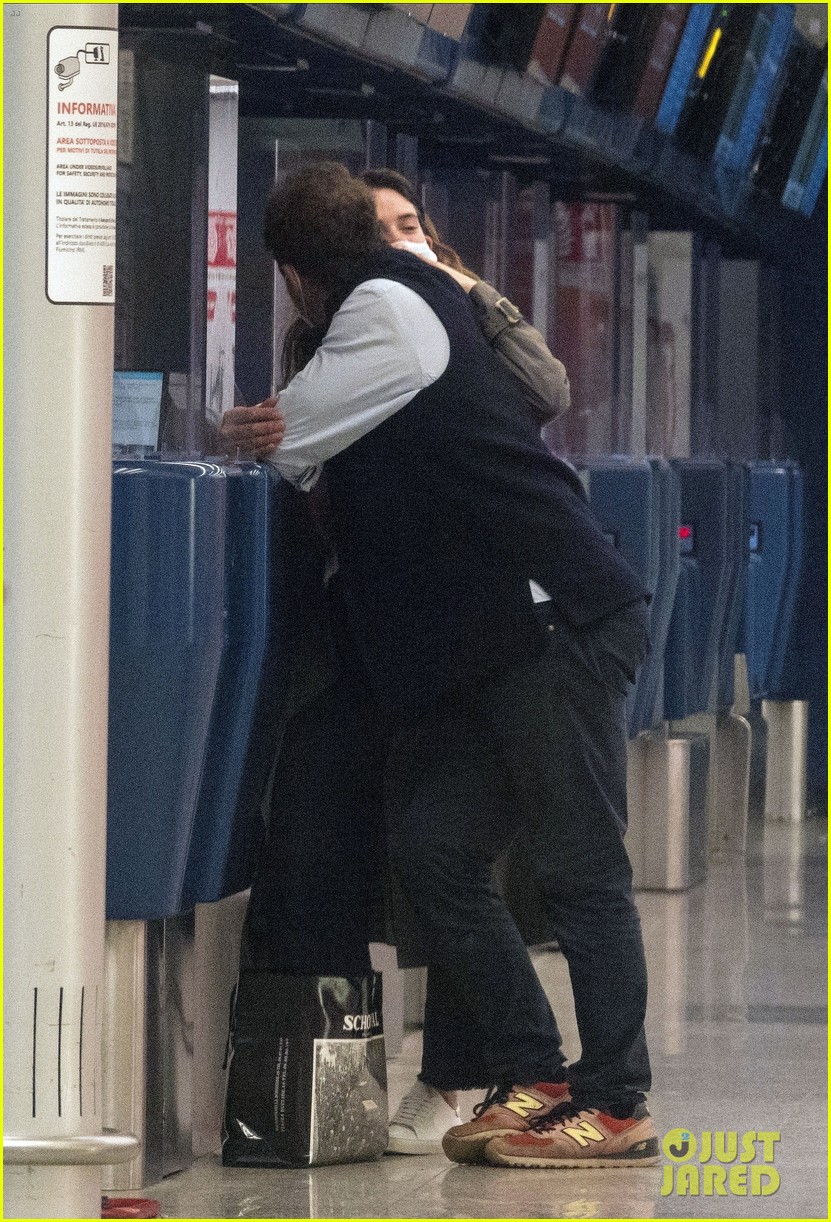 lily james dominic west hug airport 014493875