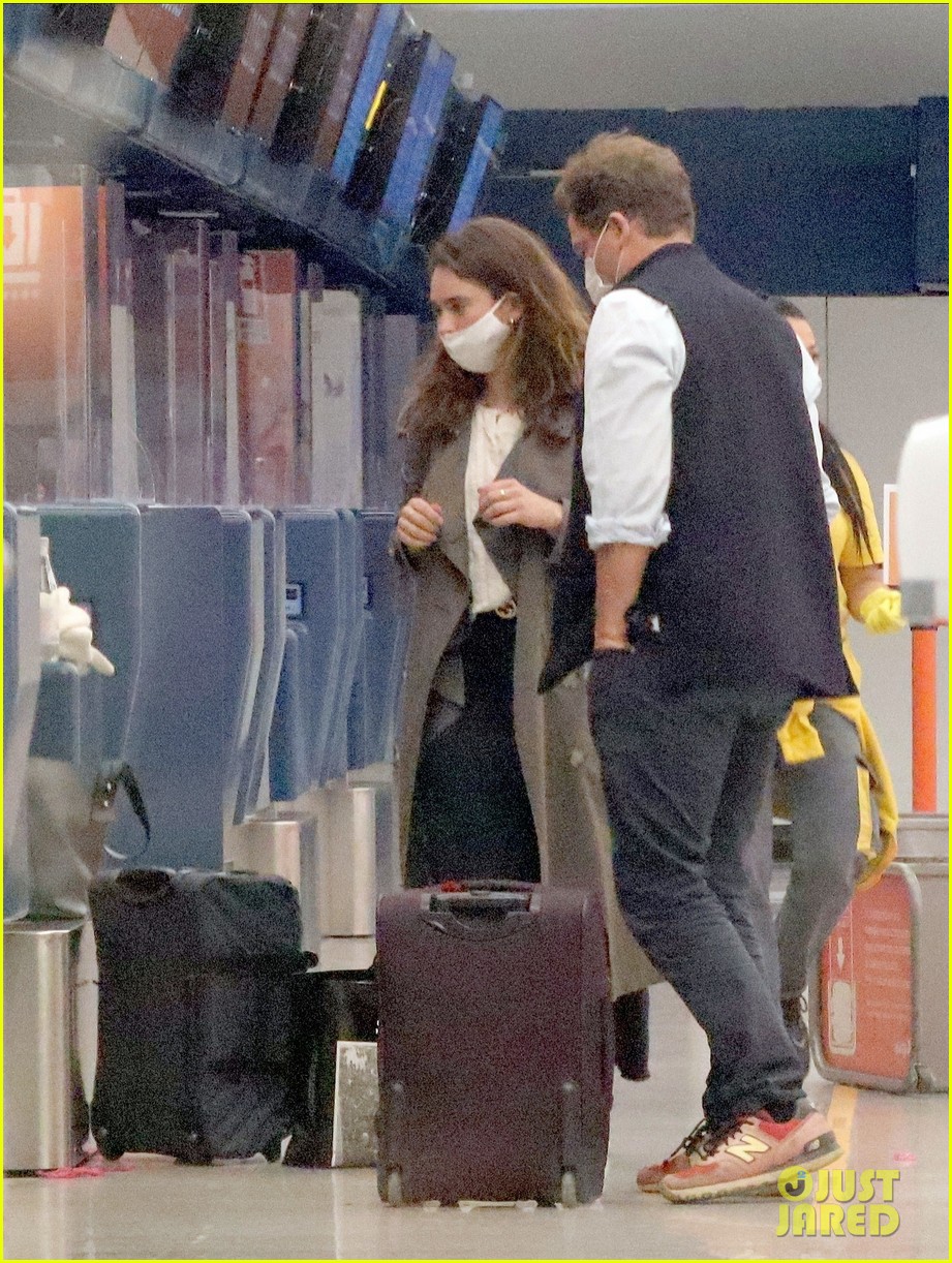 lily james dominic west hug airport 074493881