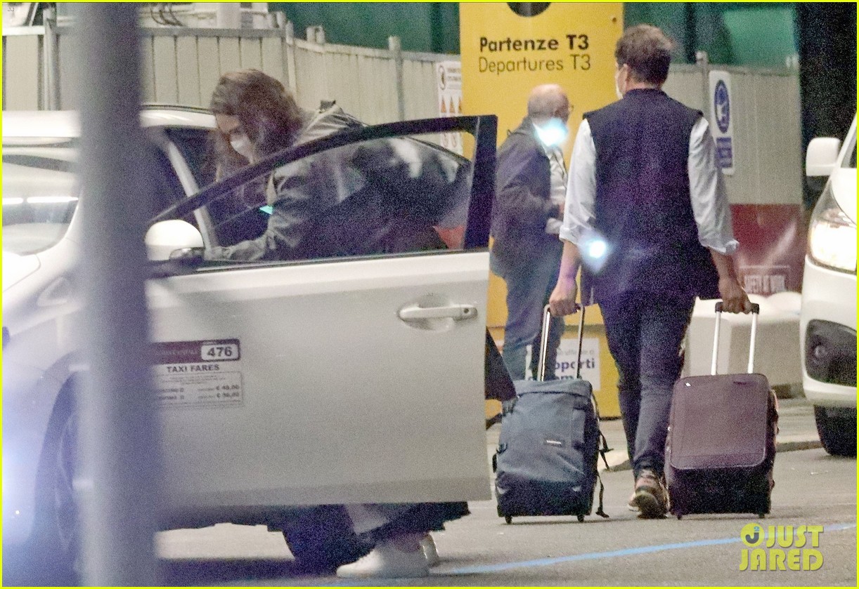 lily james dominic west hug airport 204493894