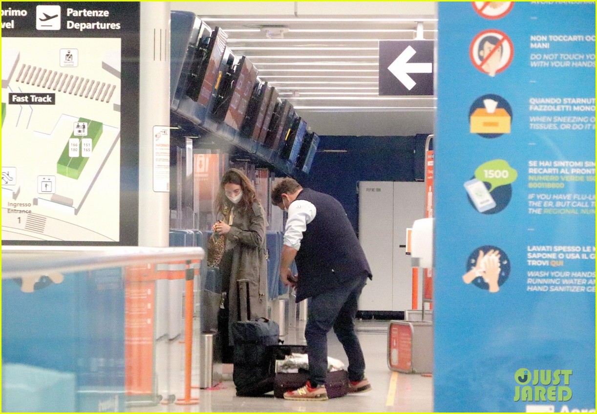 Lily James & Dominic West Cuddle at Airport After PDA Pics (Photos(02)
