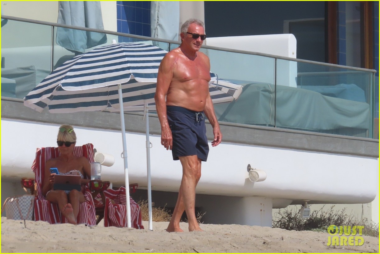 joe montana shirtless at the beach with his kids 254489448