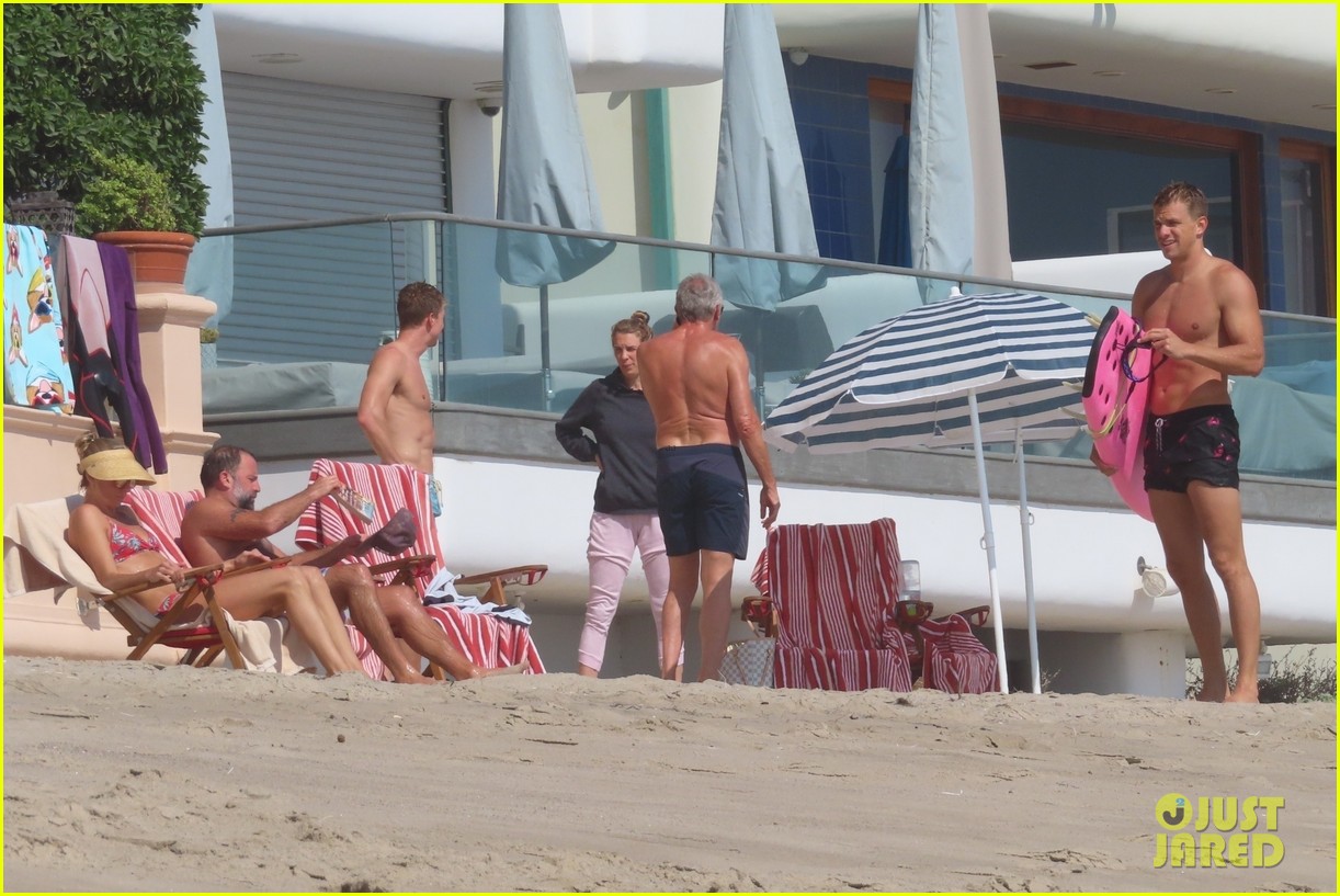 joe montana shirtless at the beach with his kids 334489456