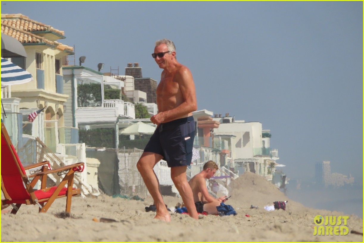 joe montana shirtless at the beach with his kids 424489465
