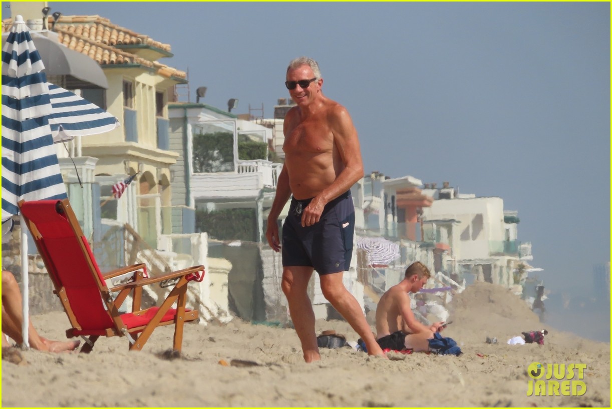joe montana shirtless at the beach with his kids 434489466