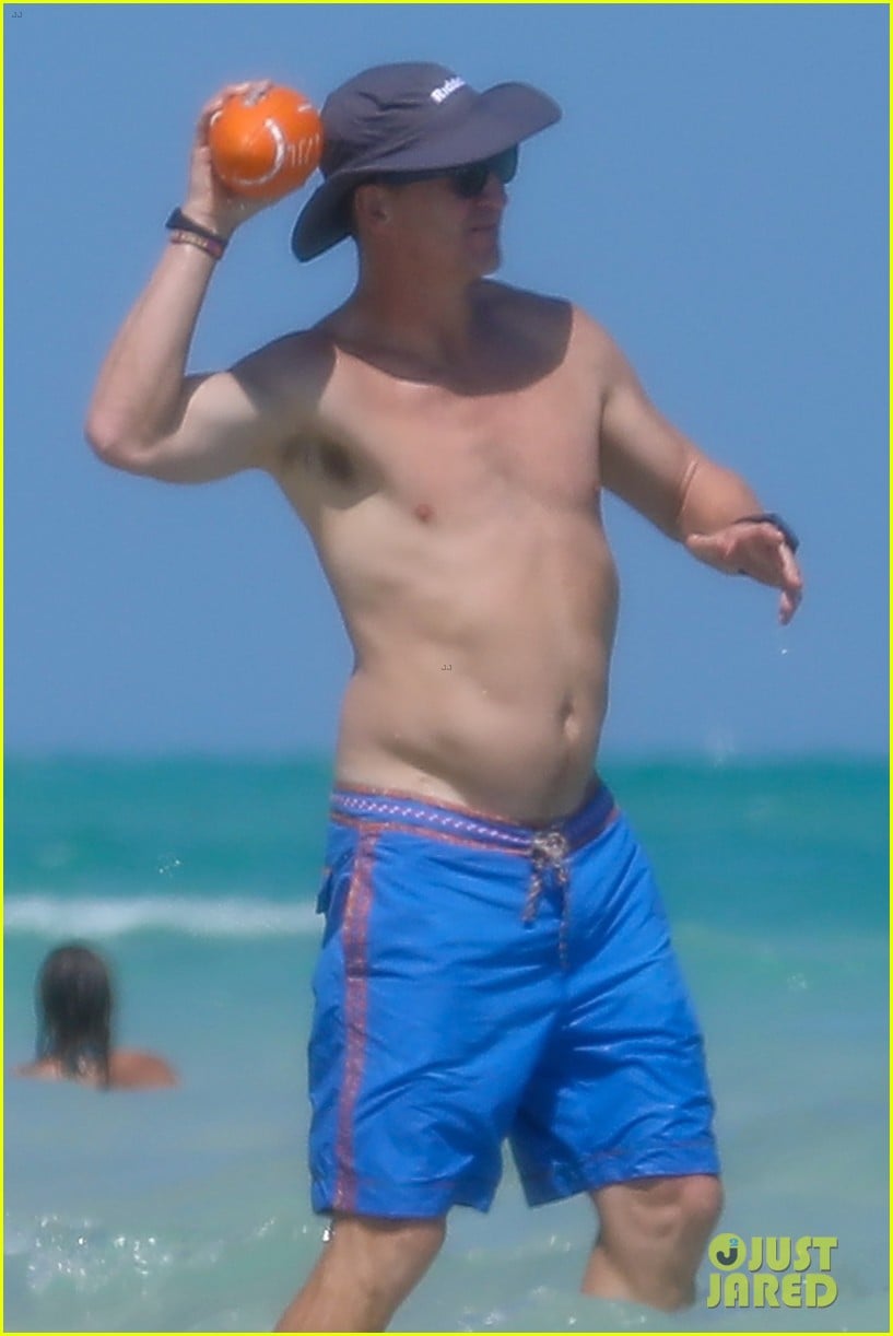 peyton manning shirtless at the beach 01