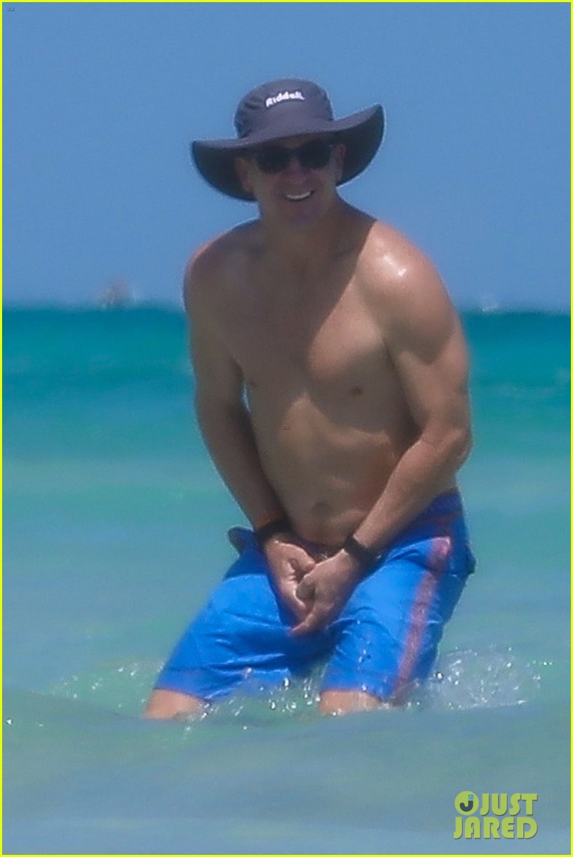 peyton manning shirtless at the beach 214492996