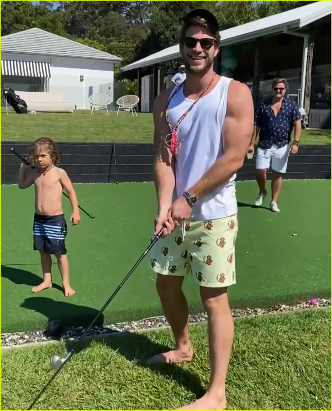 chris hemsworth jokes around while golfing with his son brother liam 044500784