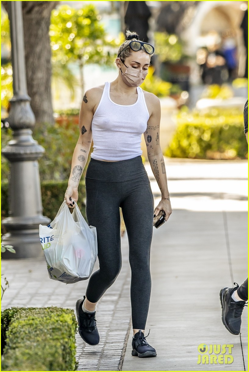 miley cyrus braless in see through tank top 31