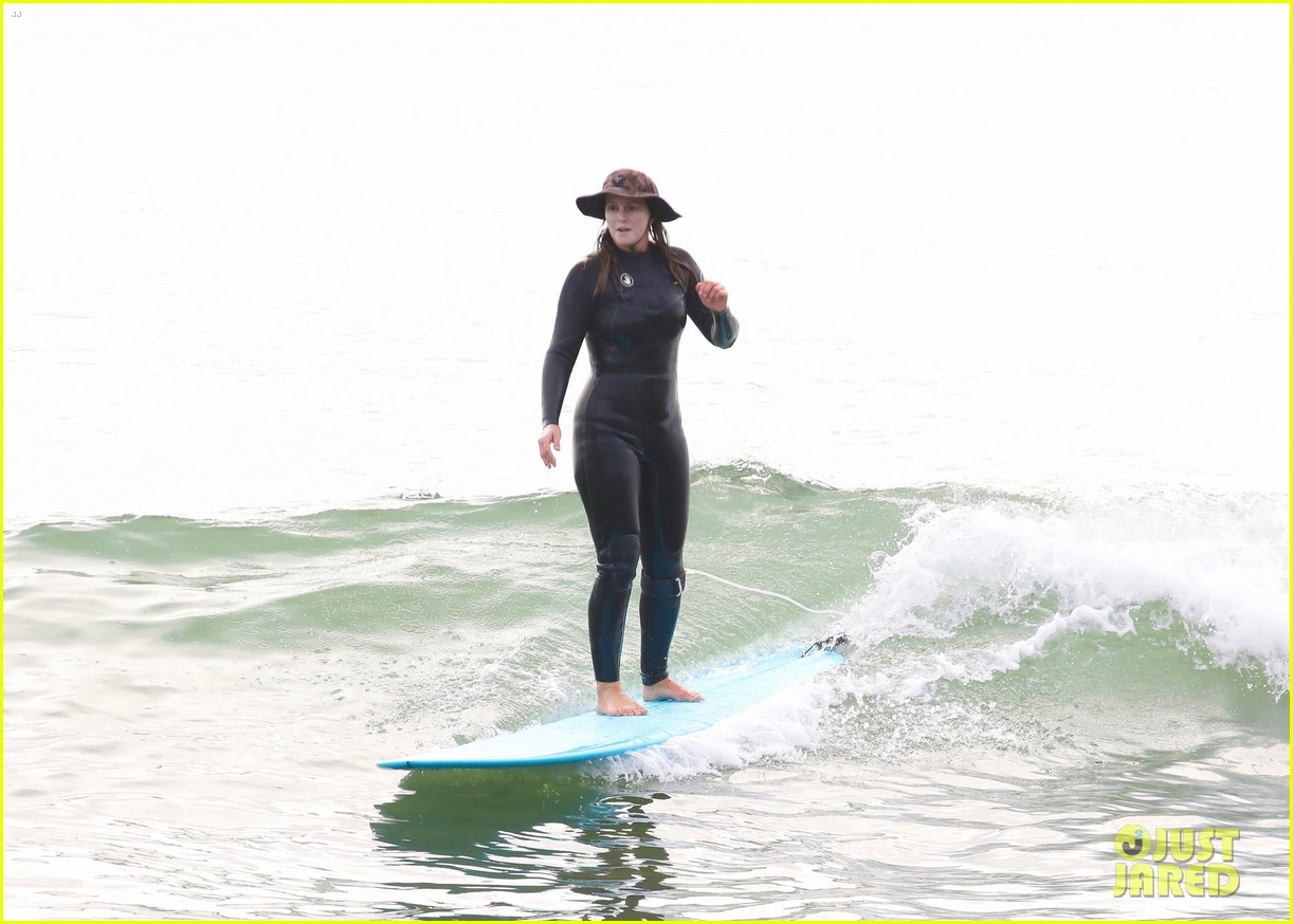 leighton meester adam brody surfing at the beach 494517041