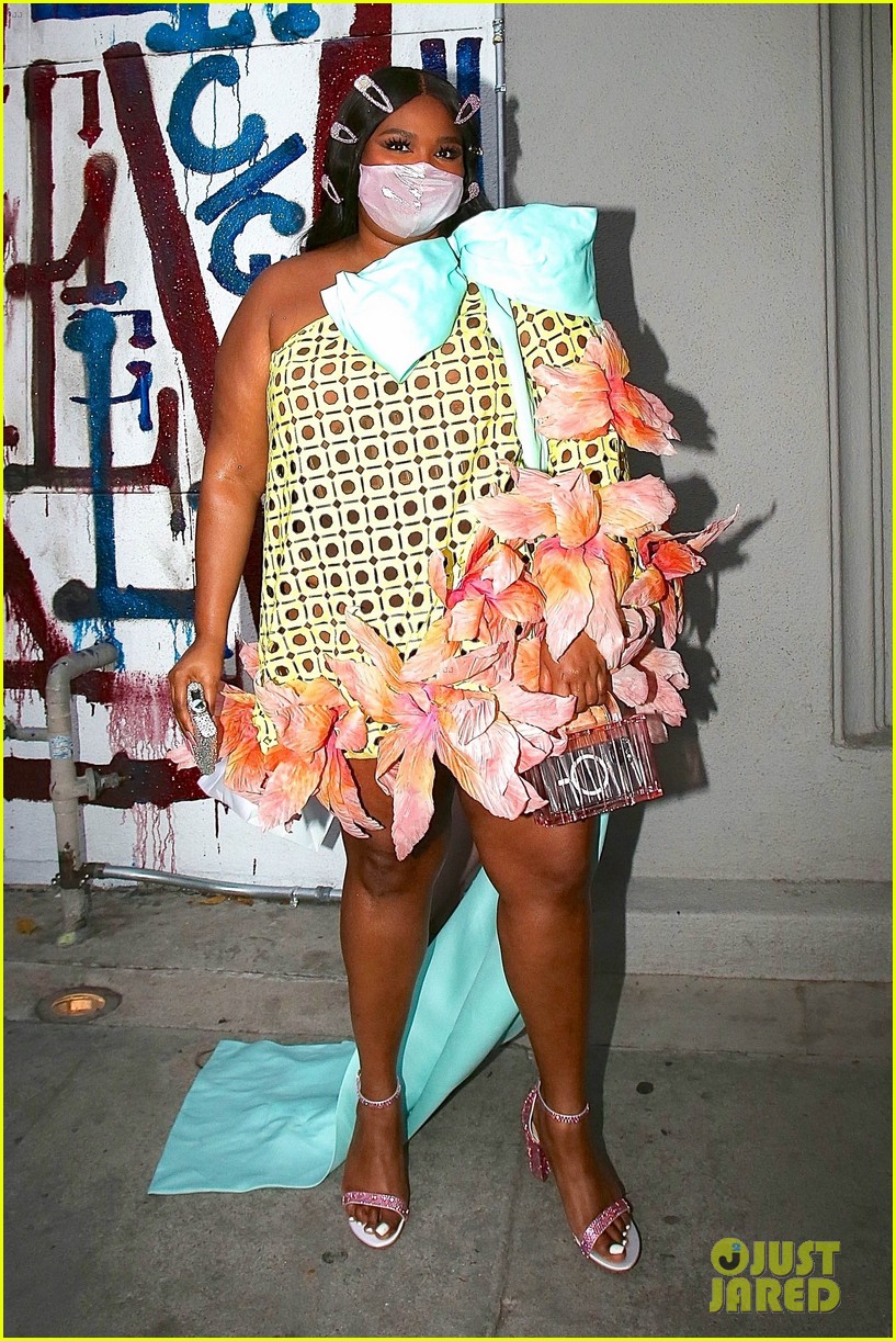 lizzo carries bedazzled flask to grammys after party 01