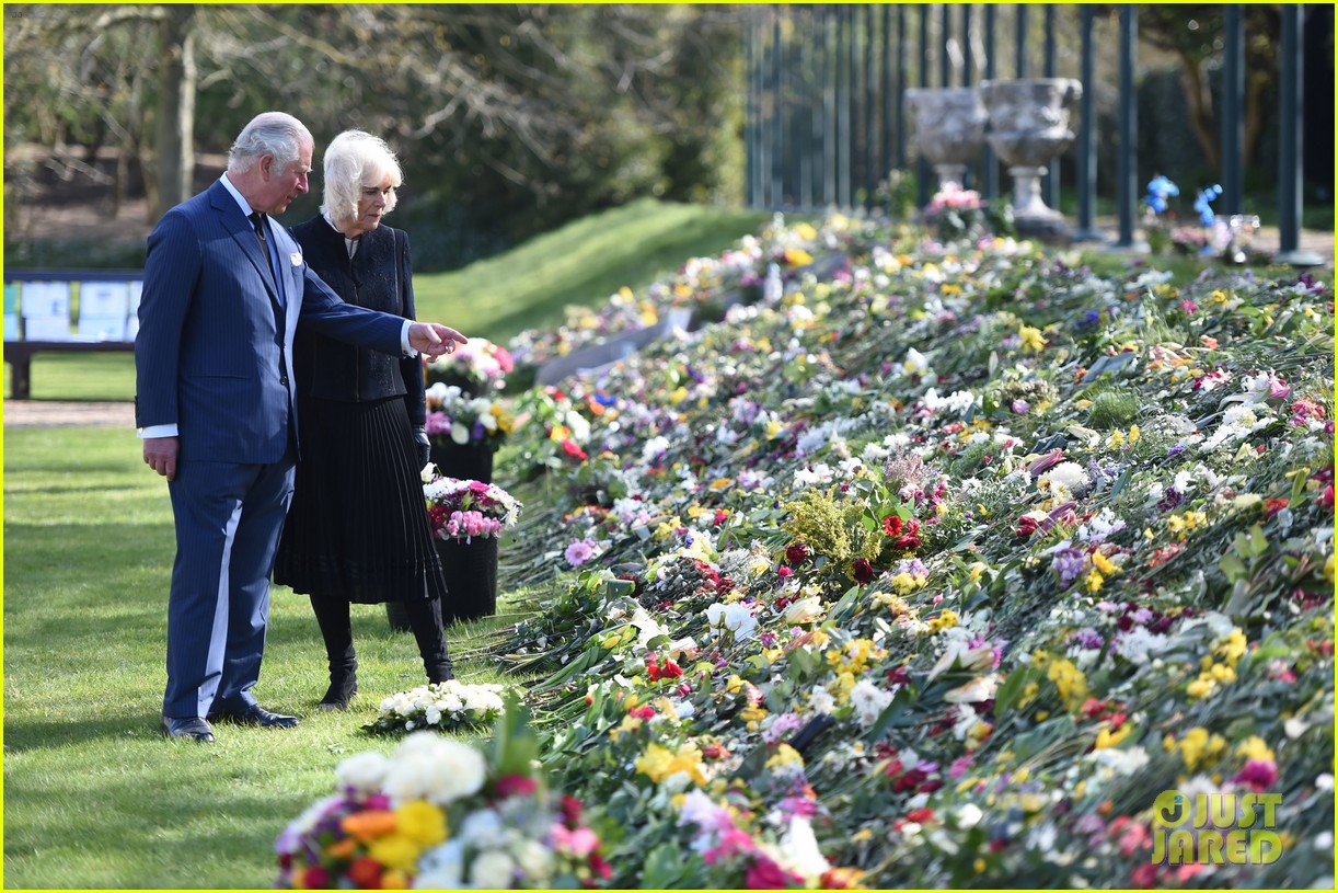 Prince Charles & Duchess Camilla View Tributes to Prince Philip Left By