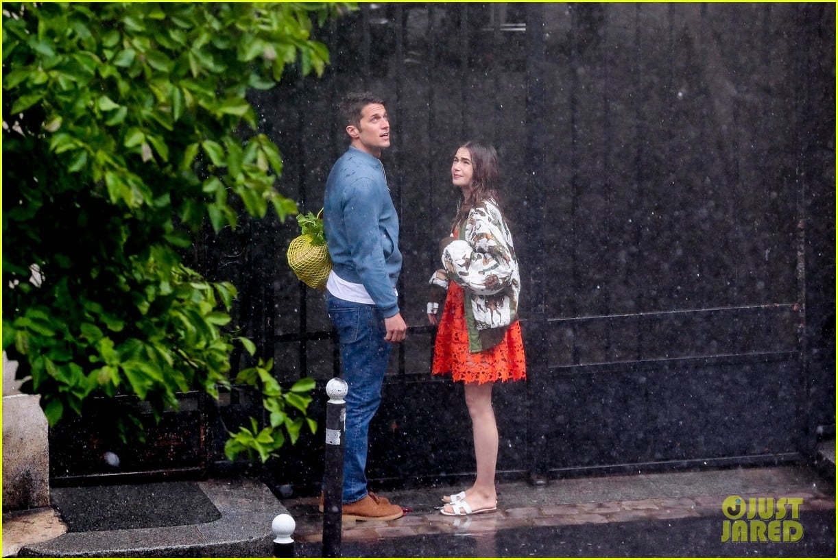 lily collins caught in rain with lucas bravo emily in paris 054557981
