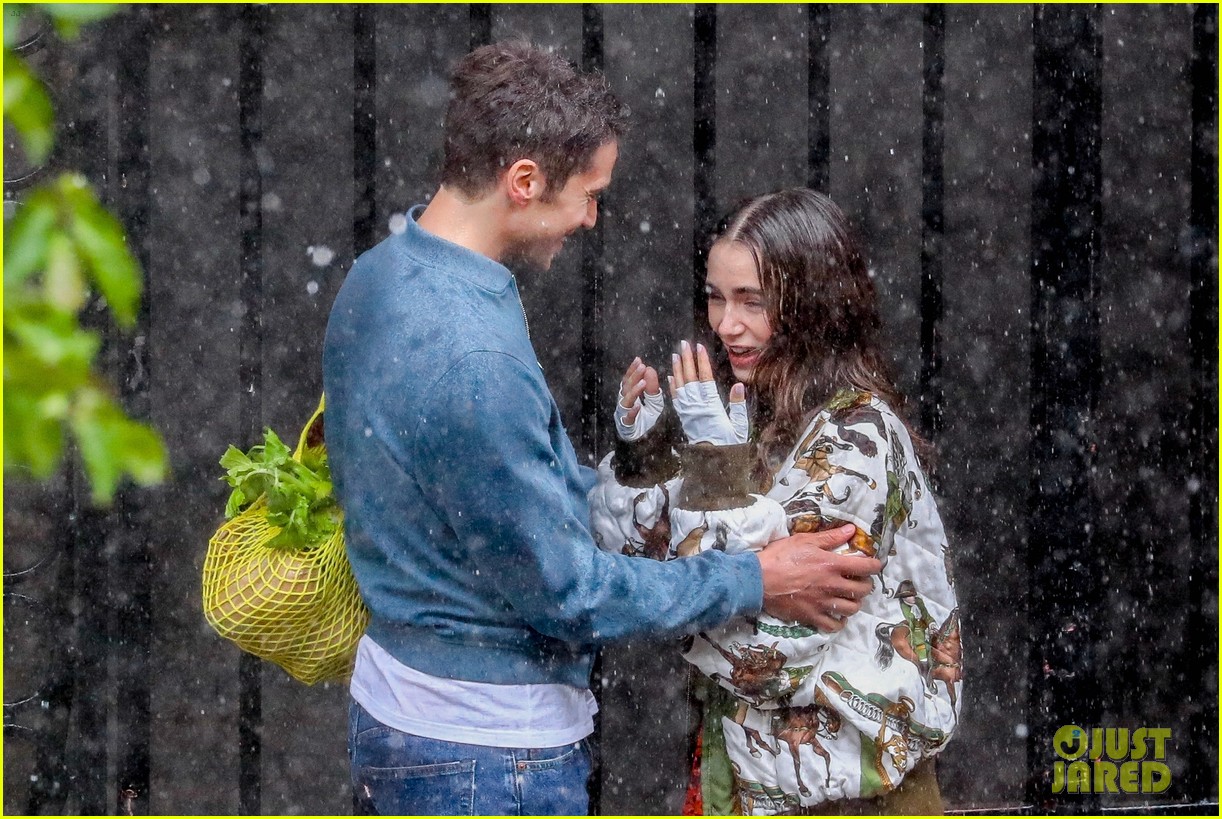 lily collins caught in rain with lucas bravo emily in paris 154557991