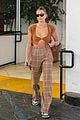 hailey bieber shows off fit figure in crop top sweater plaid pants 07