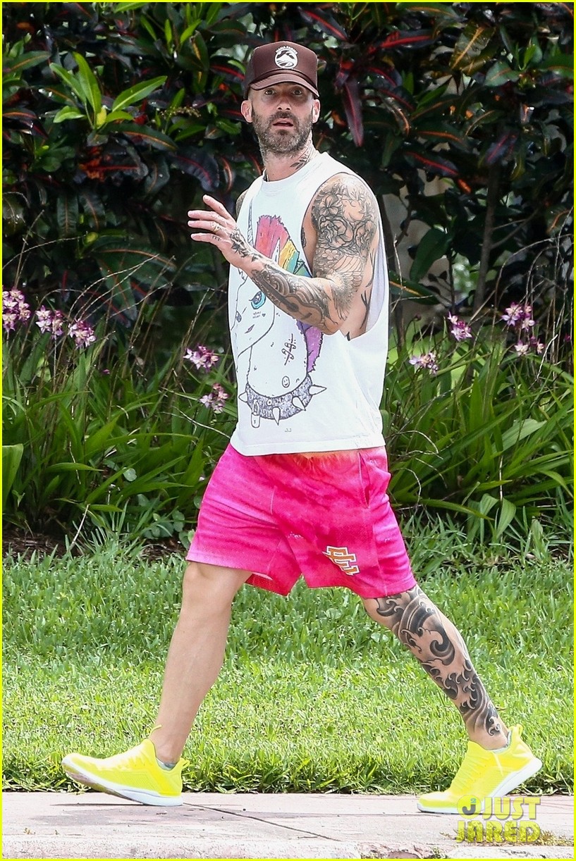 behati prinsloo at the beach while adam levine works out 044580904