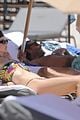 behati prinsloo at the beach while adam levine works out 07