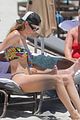 behati prinsloo at the beach while adam levine works out 08