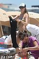 behati prinsloo at the beach while adam levine works out 14