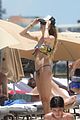 behati prinsloo at the beach while adam levine works out 17