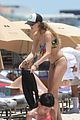 behati prinsloo at the beach while adam levine works out 18