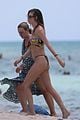 behati prinsloo at the beach while adam levine works out 25