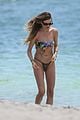 behati prinsloo at the beach while adam levine works out 28