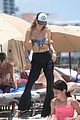 behati prinsloo at the beach while adam levine works out 39