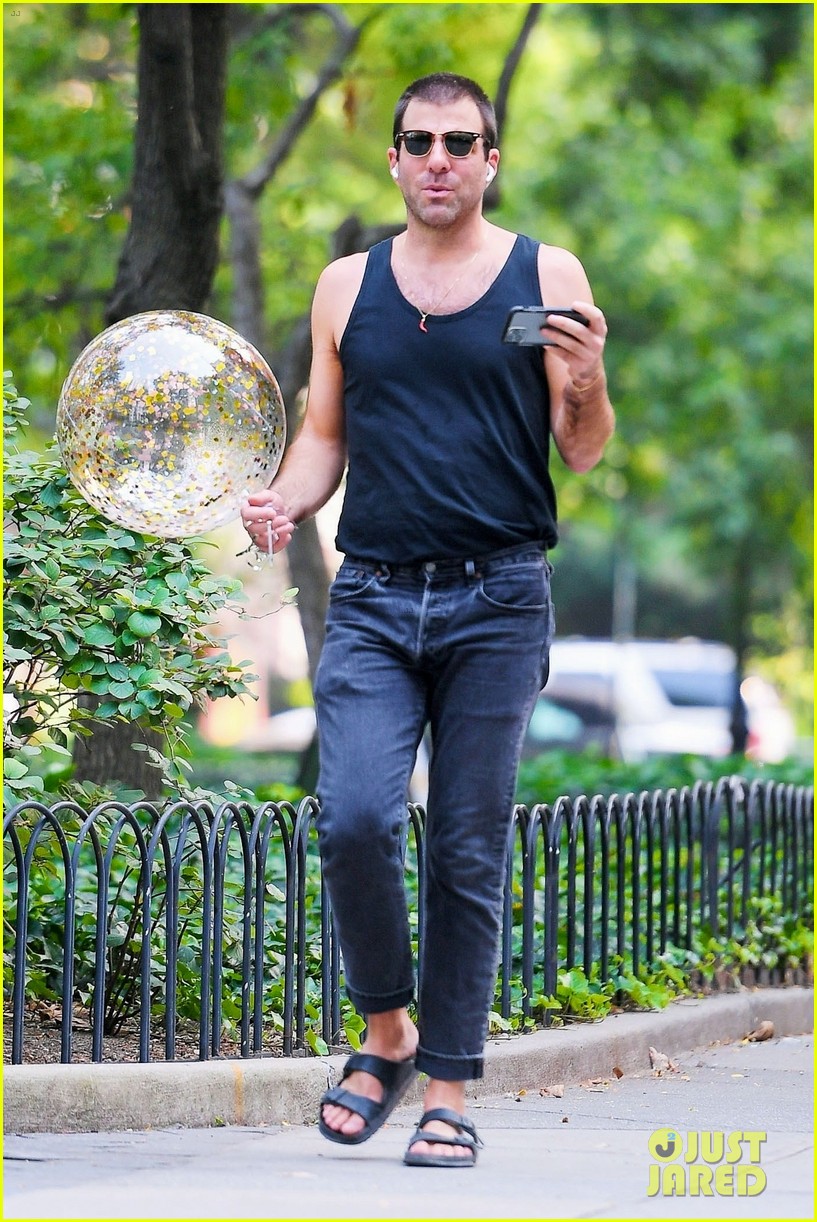zachary quinto carries balloon with him through washington square park 034596511
