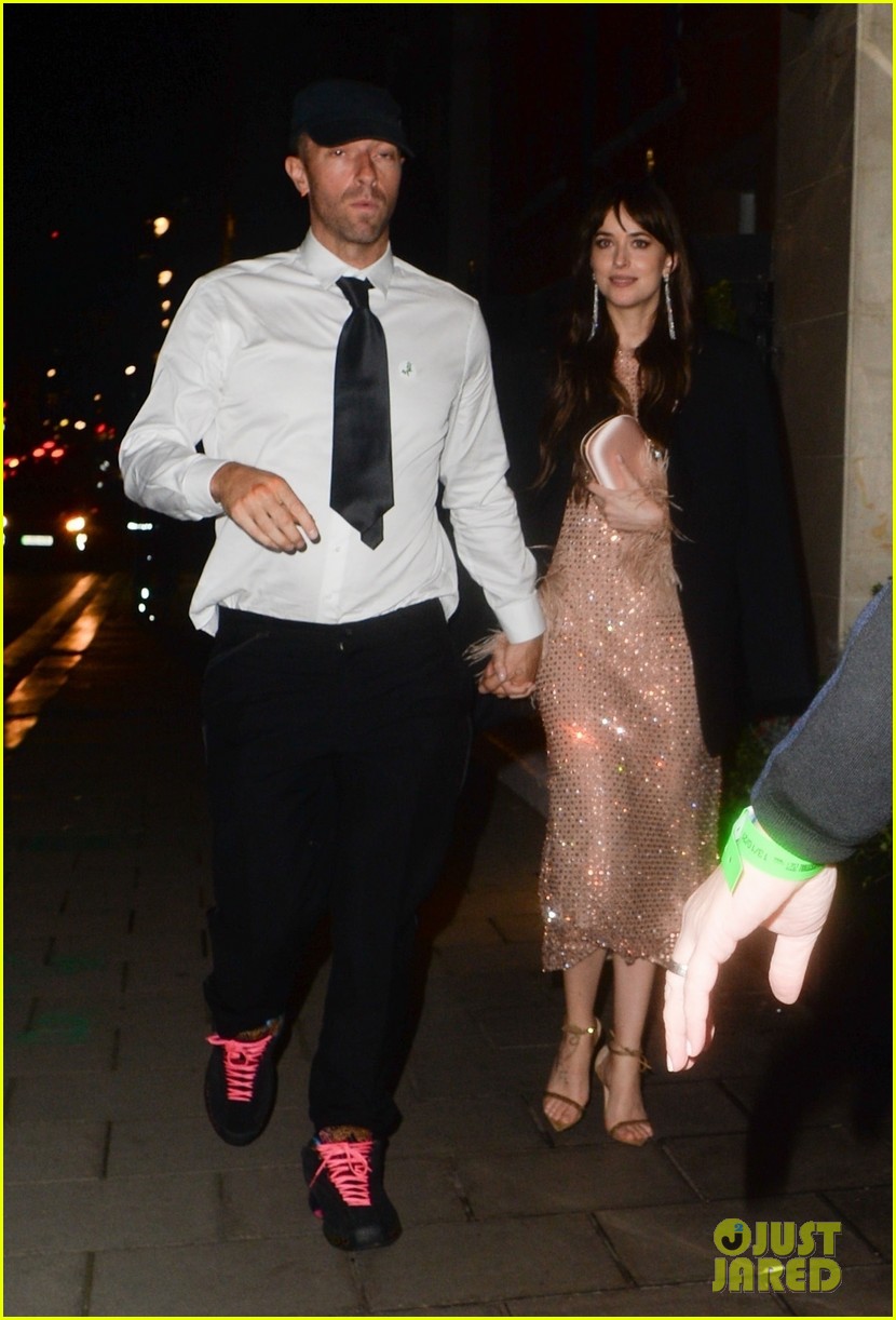 Dakota Johnson & Chris Martin Hold Hands in Rare Photos Together Photo