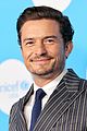 orlando bloom sports pin striped suit unicef at 75 02