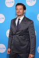 orlando bloom sports pin striped suit unicef at 75 04