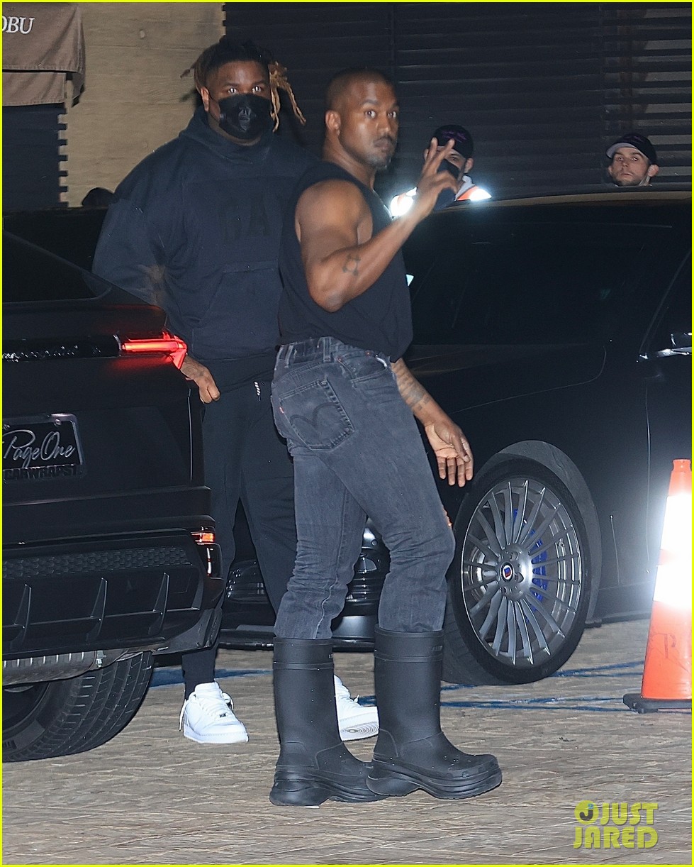 kanye west flaunts his muscles while dining with a kim kardashian lookalike 29