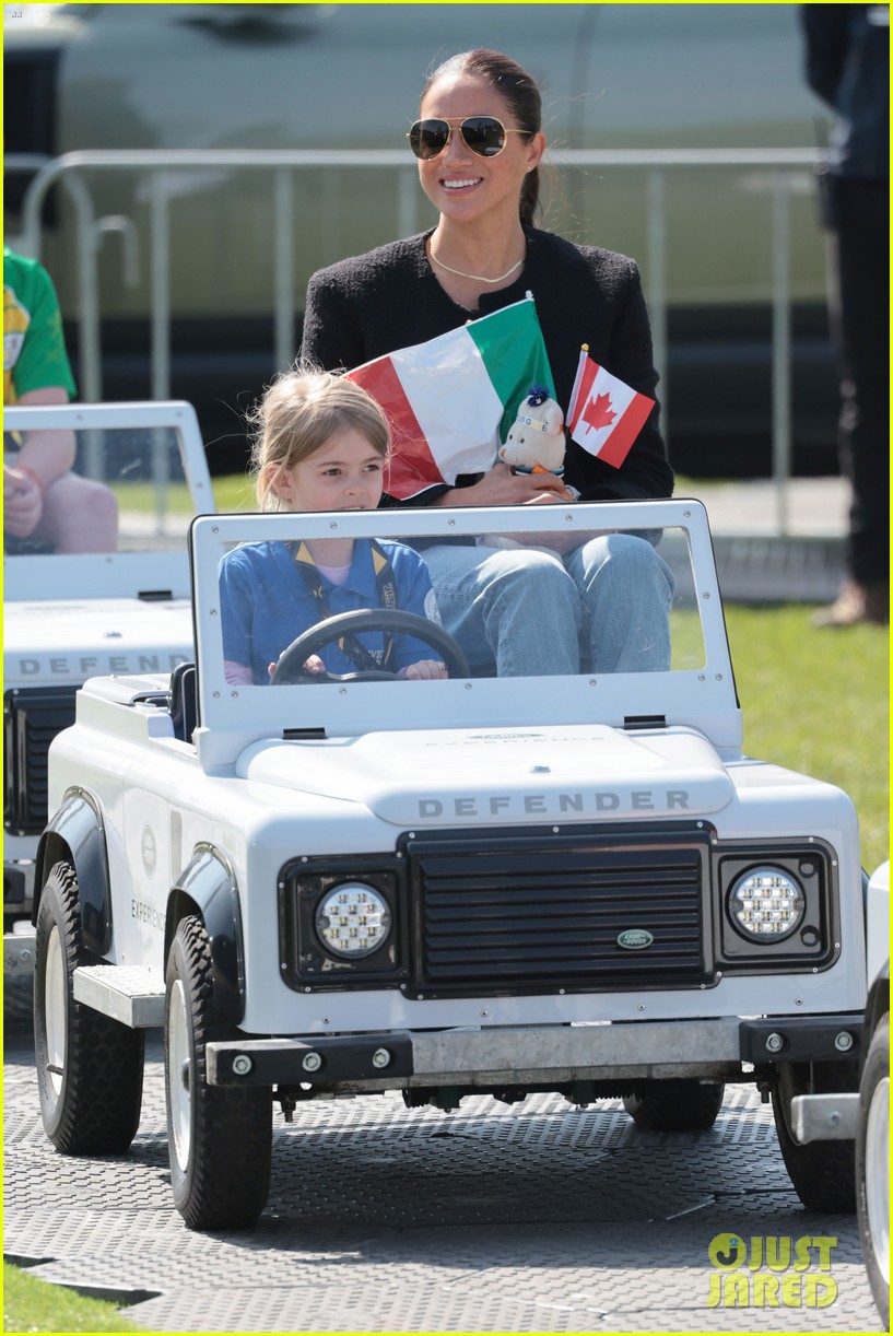 Meghan Markle & Prince Harry Take a Ride in Mini Kiddie Cars at the