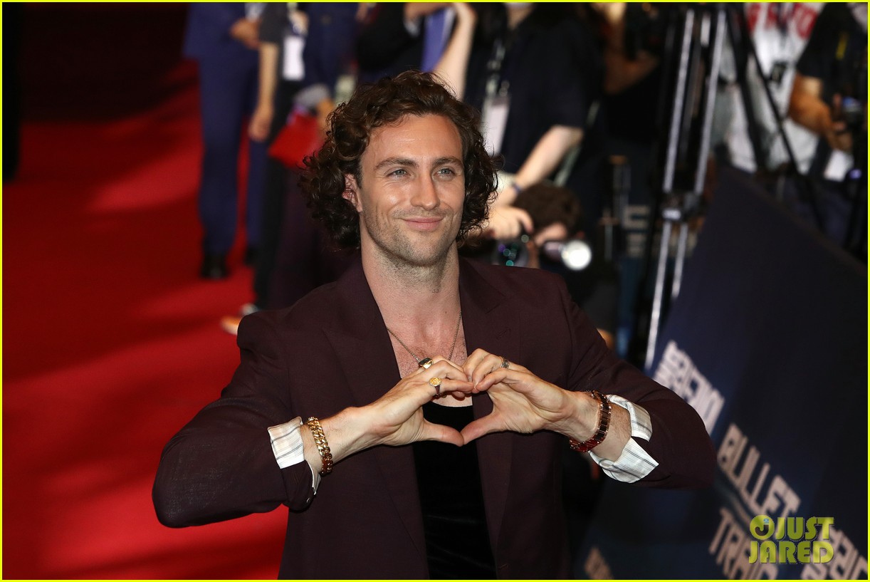 Brad Pitt & Aaron TaylorJohnson Do Adorable Heart Poses at 'Bullet Train' Seoul Premiere