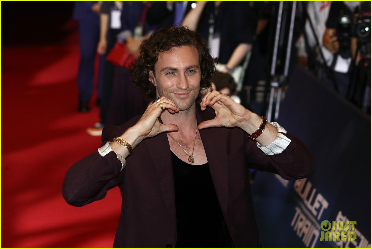 Brad Pitt & Aaron TaylorJohnson Do Adorable Heart Poses at 'Bullet Train' Seoul Premiere