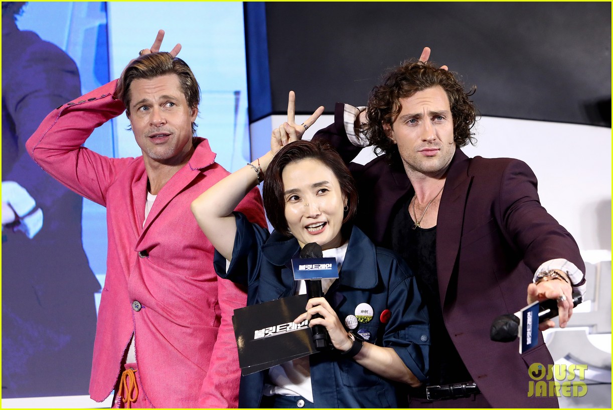 Brad Pitt & Aaron TaylorJohnson Do Adorable Heart Poses at 'Bullet Train' Seoul Premiere