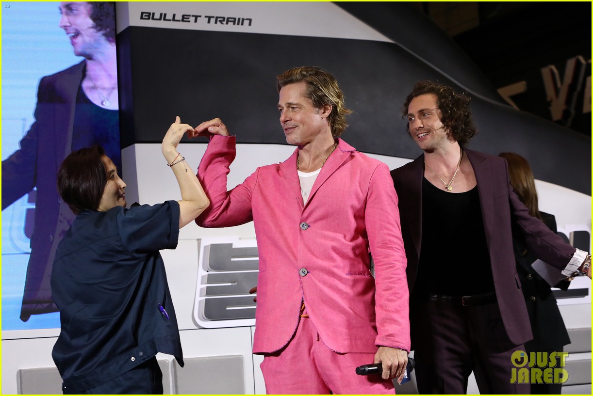 Brad Pitt & Aaron TaylorJohnson Do Adorable Heart Poses at 'Bullet Train' Seoul Premiere