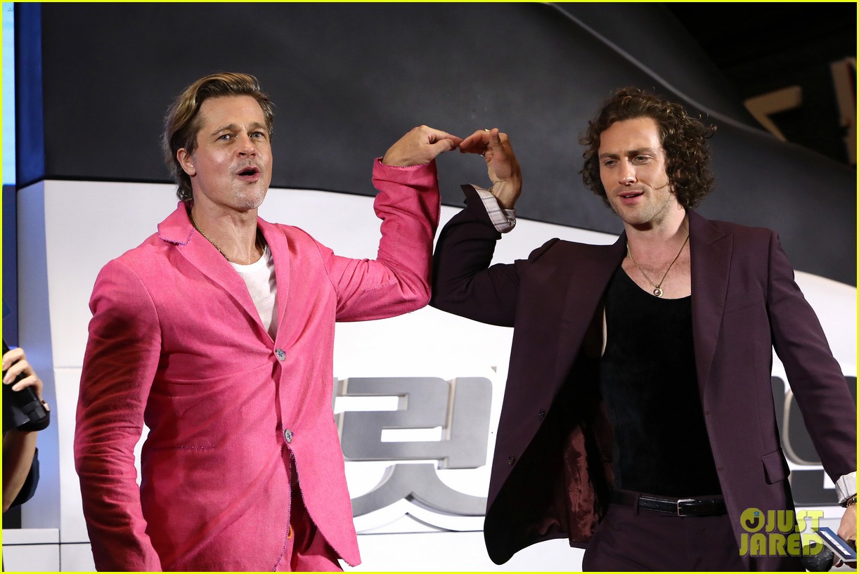 Brad Pitt & Aaron TaylorJohnson Do Adorable Heart Poses at 'Bullet Train' Seoul Premiere