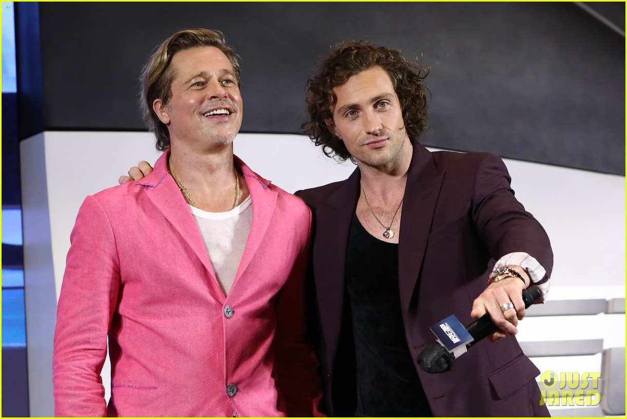 Brad Pitt & Aaron TaylorJohnson Do Adorable Heart Poses at 'Bullet Train' Seoul Premiere