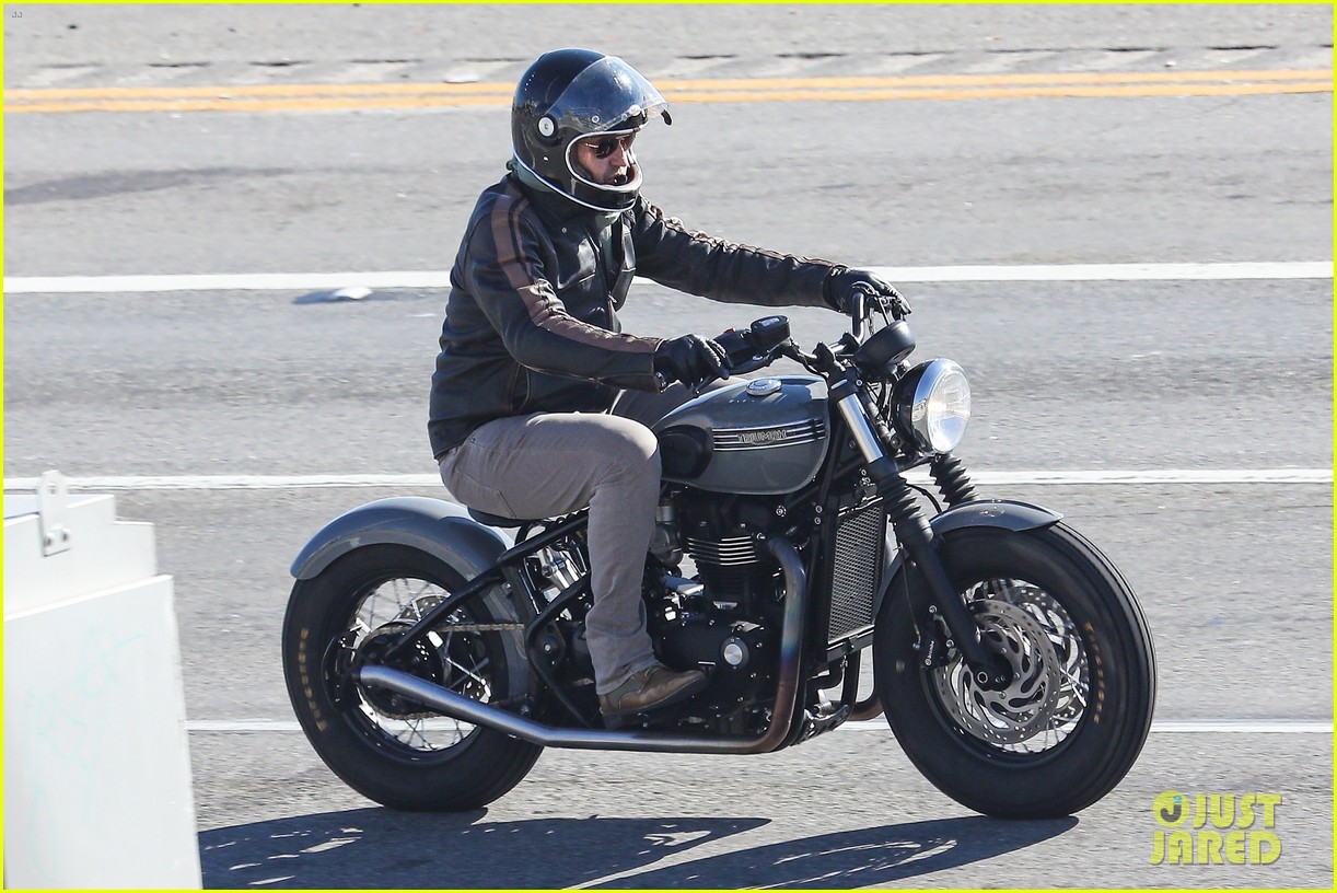 gerard butler hops on his motorcycle 014862345