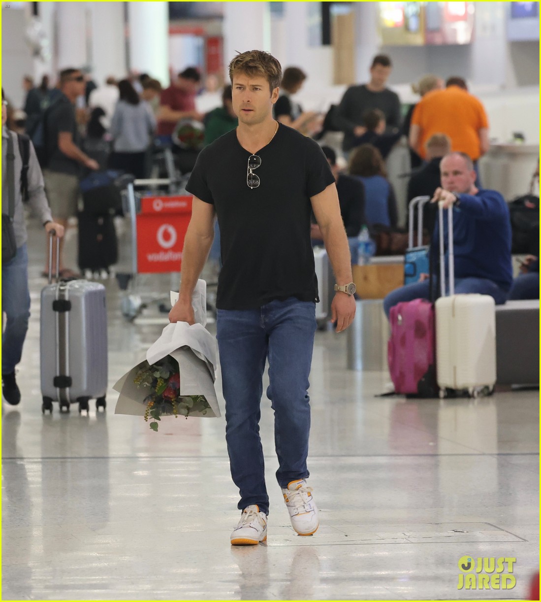 Glen Powell Greets Girlfriend Gigi Paris at the Airport in Australia