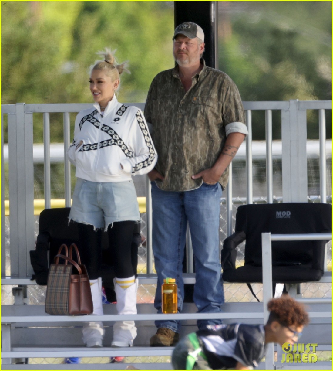 Gwen Stefani Sits on Blake Shelton's Lap, Shares a Kiss While Attending