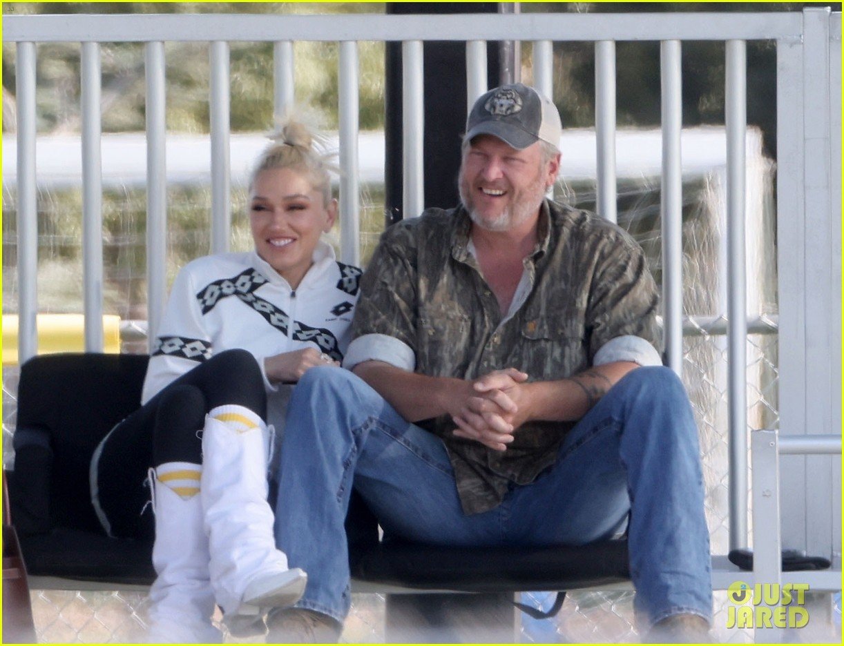 Gwen Stefani Sits on Blake Shelton's Lap, Shares a Kiss While Attending