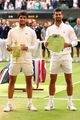 carlos alcaraz presented with trophy after wimbledon 04