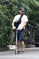 christian bale scooter around kid dog sling 02
